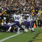 RB Najee Harris scores on a leaping jump at the goal line