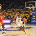 Nelly Cummings drives againt rwo Clemson defenders in the 2nd half