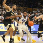 Pitt Guard Nelly Cummings drives against Wake Forest Center Davion Bradford