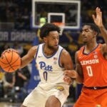 Pitt’s Nelly Cummings being guarded by Clemson’s Josh Beadle