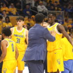 Assistant Heaad Coach Jason Capel give Federiko Federiko some instructions in the 2nd half