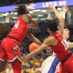 Guillermo Diaz Graham gets fouled by Louisville defenders