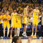 Pitt’s bench goes wild after Jamarius Burton’s Layup seals the win against Miami